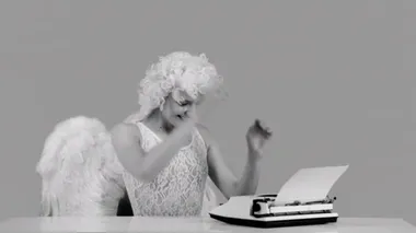 Valentines day - retro concept. Attractive woman writes the letter. Laughing angel girl enjoying valentines day. Black and white.