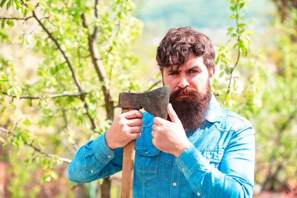 Portrait of bearded farmer with axe. Agricultural Land. Spring and hobbies. Gardener. Eco farm worker. — Stockfoto