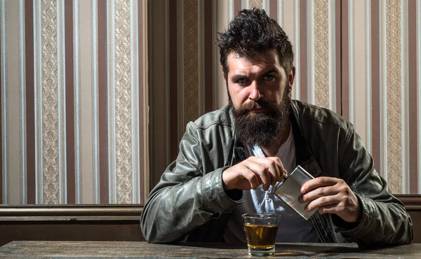 Brutal hipster relaxing. Pub great place to drink and have fun. Hipster relaxing at pub. Man with beard sitting on the table. Weekend lifestyle. — Stok fotoğraf