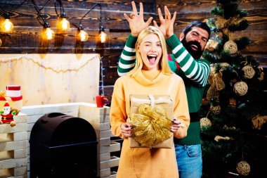 Funny Christmas couple. Gift emotions, new year gift box. Wish you merry christmas. New year.