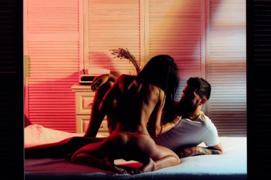 Sexy couple in love play sex games. Young lovers. Sexy couple in bed. Love and romance. Sex games. sexy couple in love. erotic games and relax massage. dominating relationship. Family. Love story