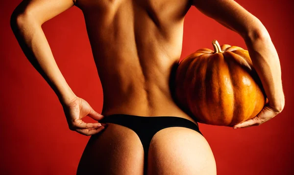 Sexy Model Posing In Lingerie on halloween background. Female with sexy ass posing. Fashion Glamour Halloween art design