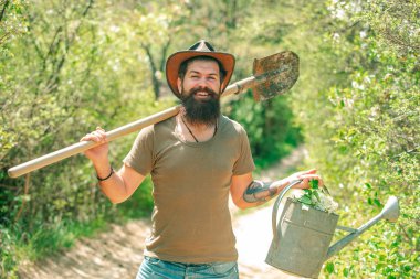 Funny Farmer with Shovel and watering can.