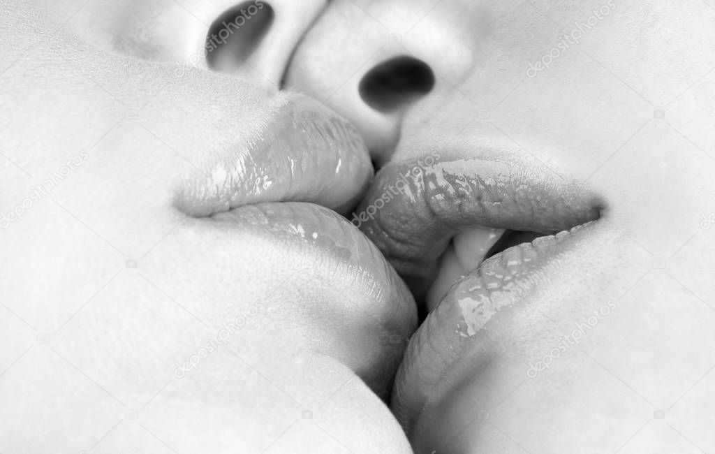 Lesbian Couple Together Concept. Kiss lesson. Two women friends kissing. Two beautiful sexy lesbians in love. Sensual kissing. Sexy plump full lips. Sexy lesbian lovers foreplay.
