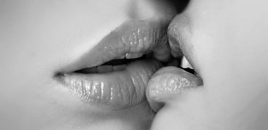 Kiss lesson. Two women friends kissing. Two beautiful sexy lesbians in love. Closeup of women mouths kissing. Passionate kissing. Sexy plump full lips. Lipstick and lipgloss. clipart