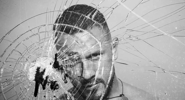 An ill wound is cured. Hispanic man bleeding from bullet wound. Latino man with blood wound on face and broken glass. Handsome wounded guy with skin deep injury wound — Stock Photo, Image