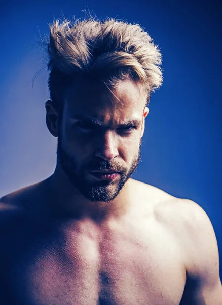 Closeup man portrait. Man face. Handsome bearded man - face half on grey background. Sad and stress man. Hipster. Mans fashions, stylish male model