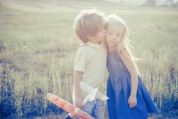 Valentines day concept. Kids kiss. Love story for cute children. The concept of child kindness and childhood. — Stock Photo, Image