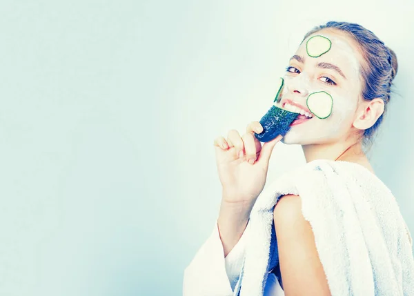 Healthy and beautiful. Girl chilling making clay facial mask with cucumber. Skin health. Woman adorable smiling girl with clay mask. Cleaning and care for young skin. Proper approach to clean skin — Stock Photo, Image