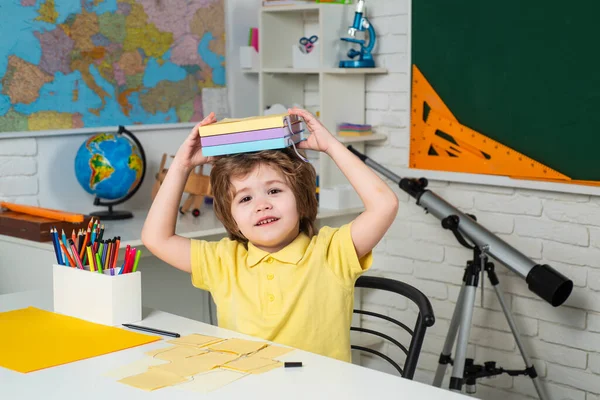 Happy cute clever boy with book. Kids gets ready for school. Child tutoring. Elementary school. Kids from primary school. — Stock Photo, Image