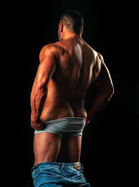 Man buttocks or butt in underwear against black studio background isolated. Backside booty concept, — Stock Fotó