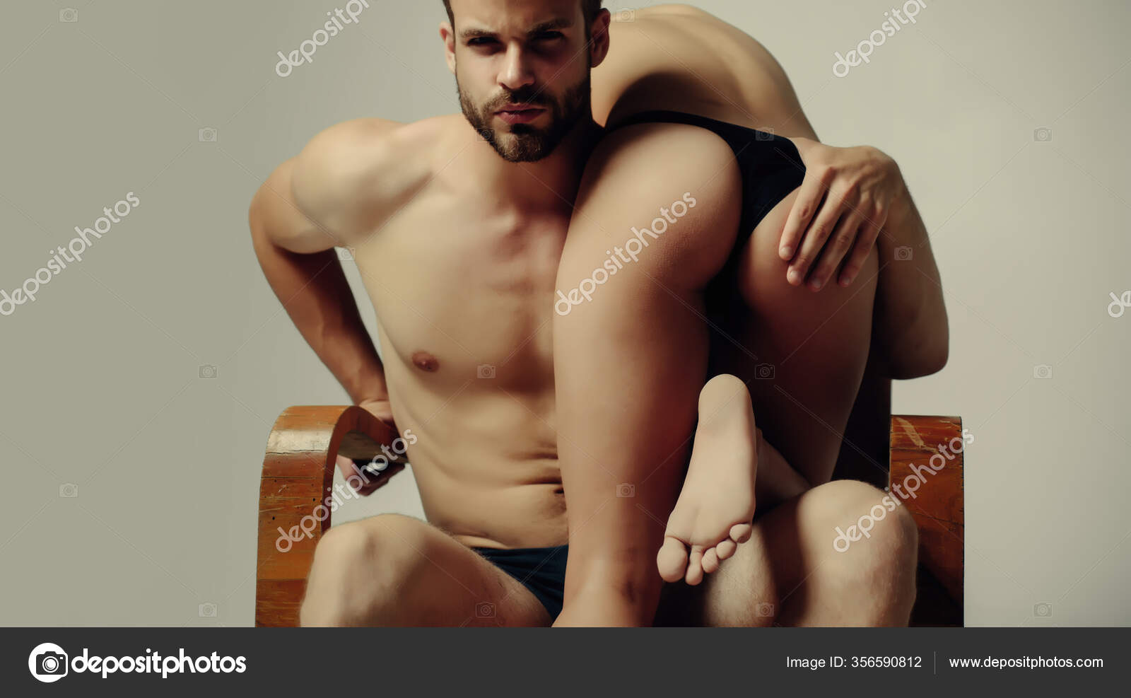 Brutal muscular bearded man touching girls sexy ass. Handsome dominating man going to give his sexy girl a smack. Foreplay and sex games concept. Couple full of desire pic