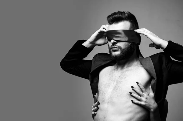 Blindfolded. Sexy girl closes eyes of a man. Woman covering man eyes. — Stock Photo, Image