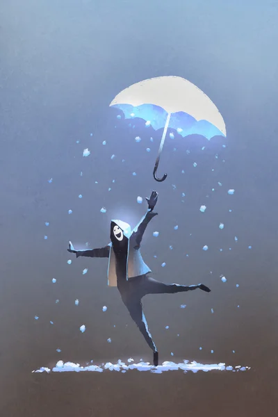 Счастливый человек бросает фэнтези зонтик с падающим снегом — стоковое фото