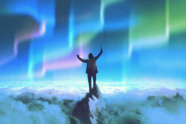 the conductor on top of a mountain against night sky with Northern Lights