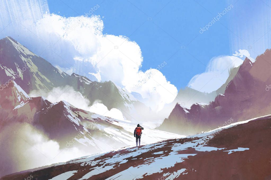 hiker with backpack looking at mountains