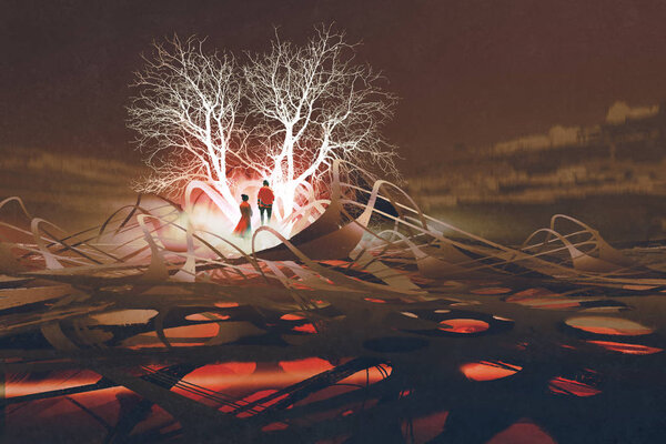 the couple standing in front of glowing trees