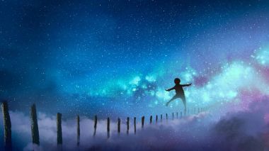 the boy balancing on wood sticks against the Milky Way