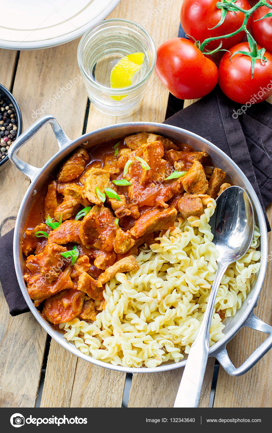 Meat pork in thick tomato gravy with pasta — Stock Photo © larik_malasha 132343640