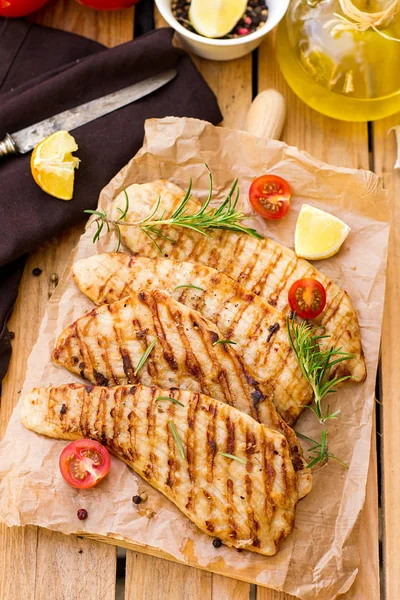 Grilled pork escalopes with rosemary and cherry tomatoes — Stock Photo, Image