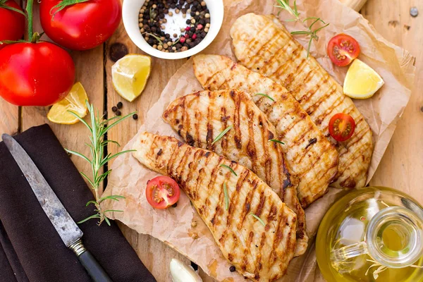 Grilled pork escalopes with rosemary and cherry tomatoes — Stock Photo, Image