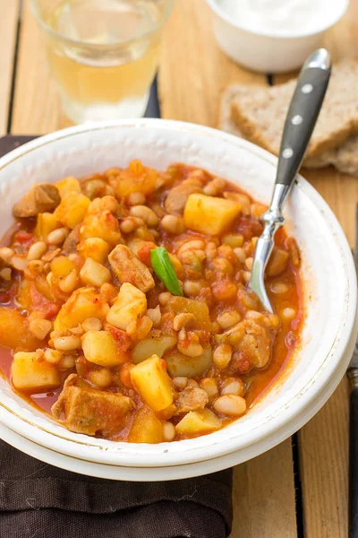 Potato stew with pork and white kidney beans — Stock Photo, Image