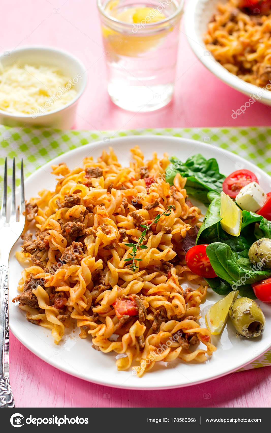 Pasta fusilli with ground beef and tomato sauce Stock Photo by ©larik