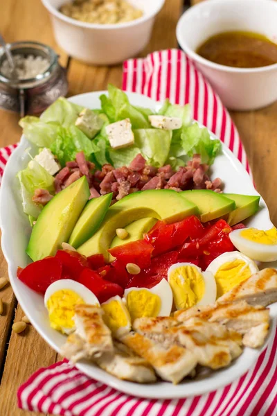 American garden salad Cobb salad with fresh vegetables and chick