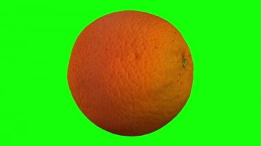 bir dönen 3d render turuncu (için yeşil ekran anahtarlama) yeşil zemin üzerine. Video sorunsuz döngü.