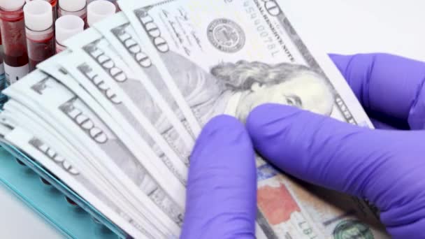 Closeup Doctor Hand Surgical Glove Placing Big Pile American Dollar — Stock Video