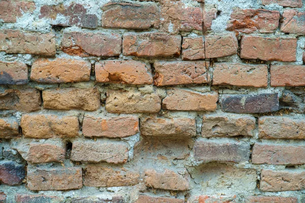 Huysuz eski kırmızı tuğla duvar dokusu arkaplanı ve yaştan sonra bozulma