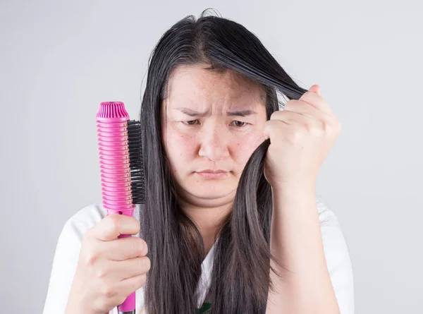 Women with hair rollers are serious about hair problems