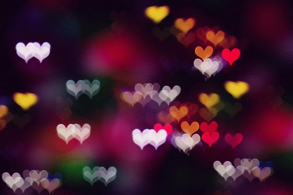 Kleurrijke hart bokeh aquarel achtergrond op papier textuur — Stockfoto