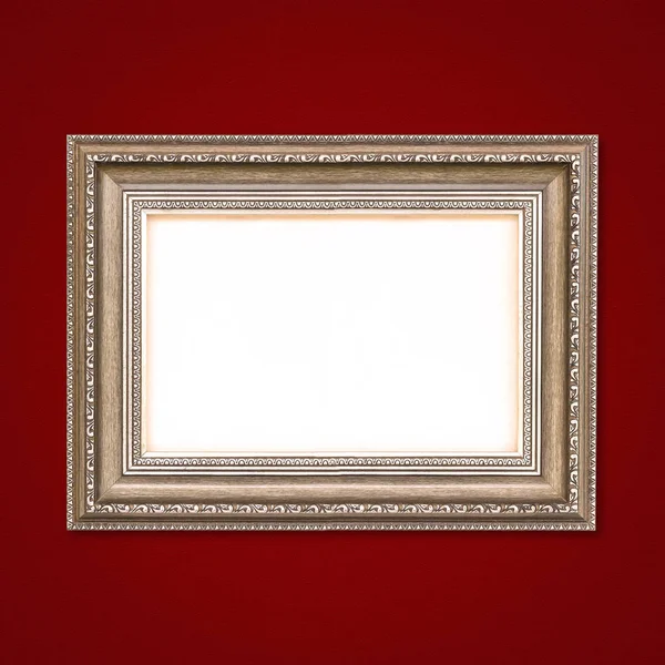 Klassiek houten frame op de rode muur — Stockfoto