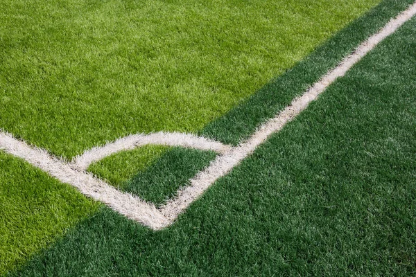 Grönt gräs textur i fotbollsplan — Stockfoto