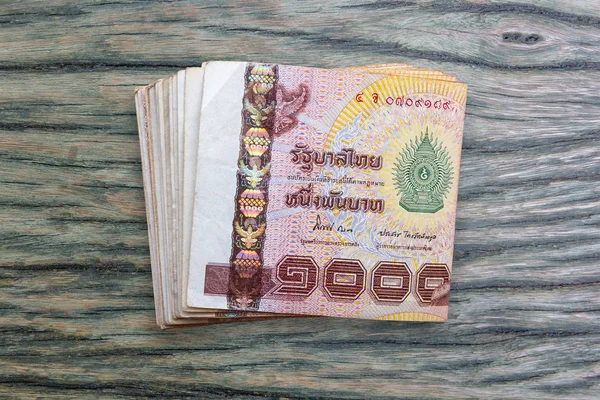 Thai money on wood background. — Stock Photo, Image