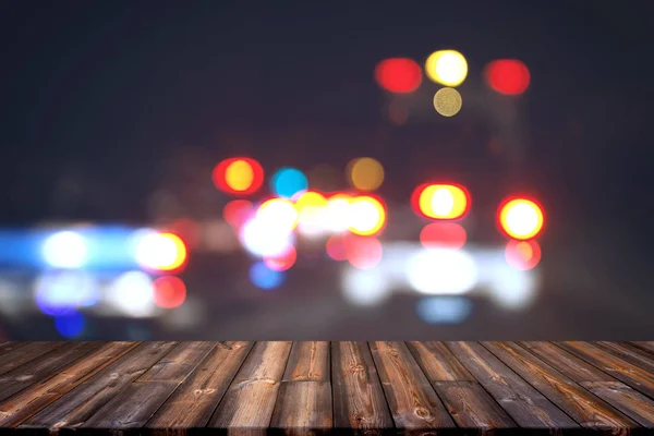 Wooden floor and city light with bokeh night background. — Stock Photo, Image
