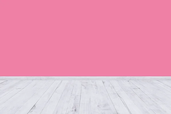 Roze kamer muur met houten vloer textuur. — Stockfoto