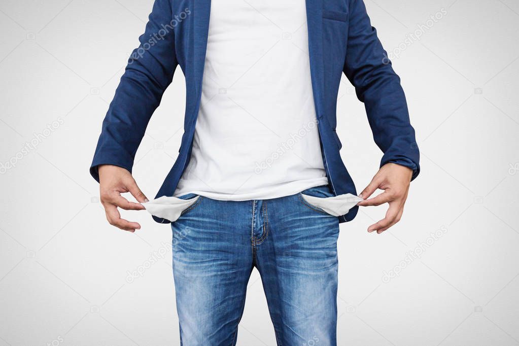 Man showing his empty pockets