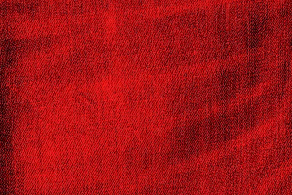 Текстура красных джинсов — стоковое фото
