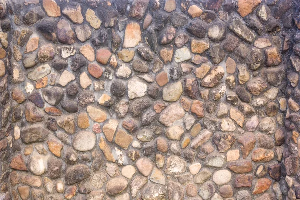 Fond et texture de la surface du mur de pierre de granit. — Photo