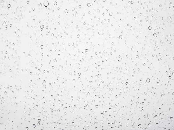Абстрактная капля дождевой воды на стеклянной текстуре . — стоковое фото