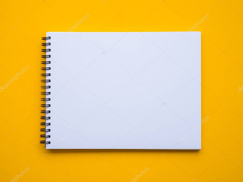 Notepad on yellow background