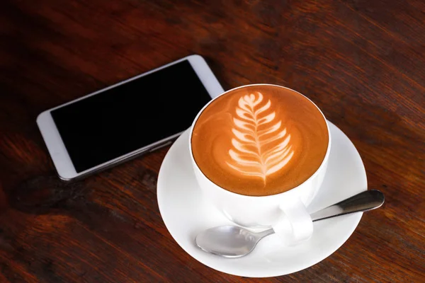 Hot coffee cup on old wood table background — Stock Photo, Image