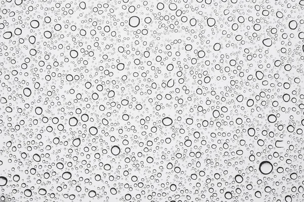 Regn vattendroppe på fönster glas bakgrund — Stockfoto