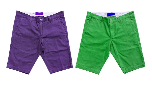 Pantalones cortos púrpura y verde sobre fondo blanco — Foto de Stock