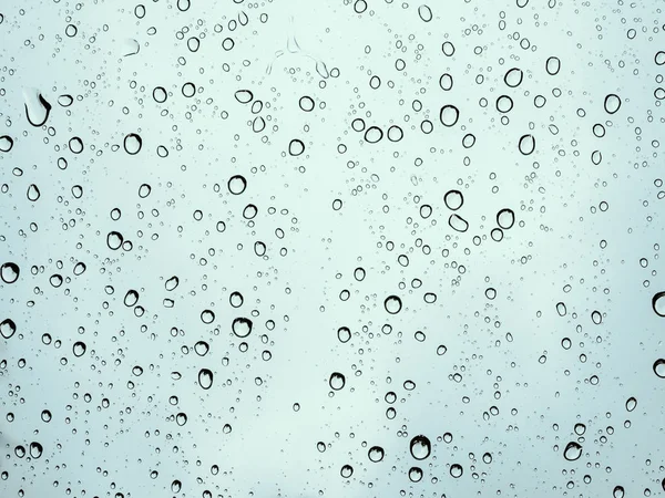 Gouttes de pluie sur la texture de voiture en verre . — Photo