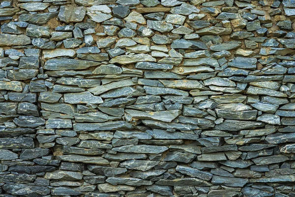 Hintergrund und Textur der Granitsteinmauer. — Stockfoto