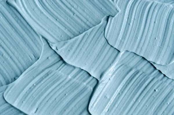 Blue cambrian cosmetic clay (facial mask, cream) texture close up, selective focus. Abstract background — Stock Photo, Image