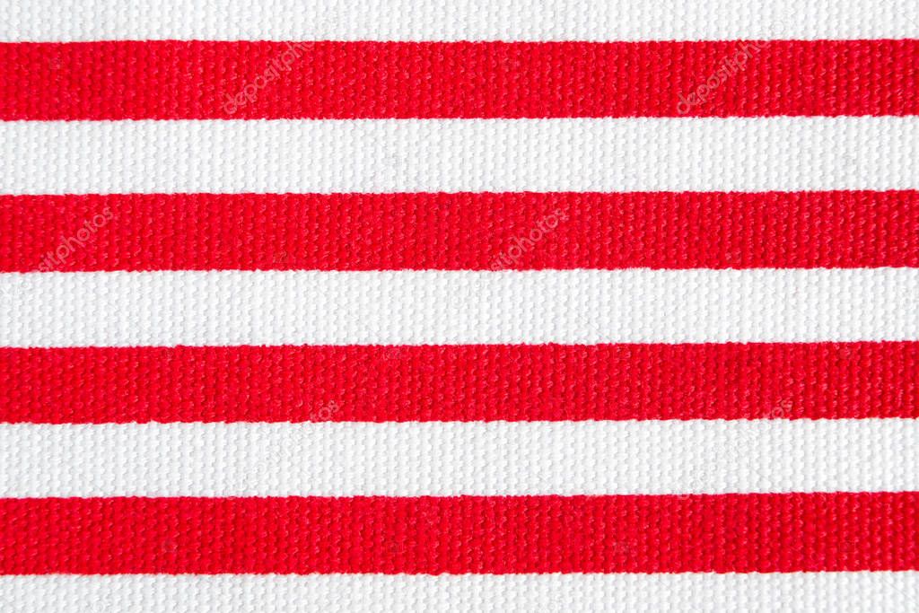 Textile background with red and white stripes. Fabric texture